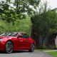 A photo of a red Maserati Ghibli sports sedan.